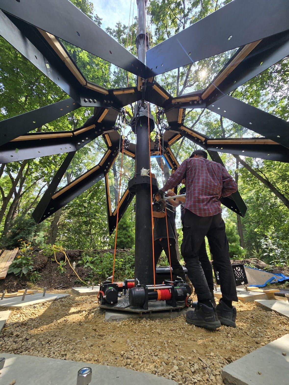 O2 Treehouse crew constructing Moonhaven’s geometric frame